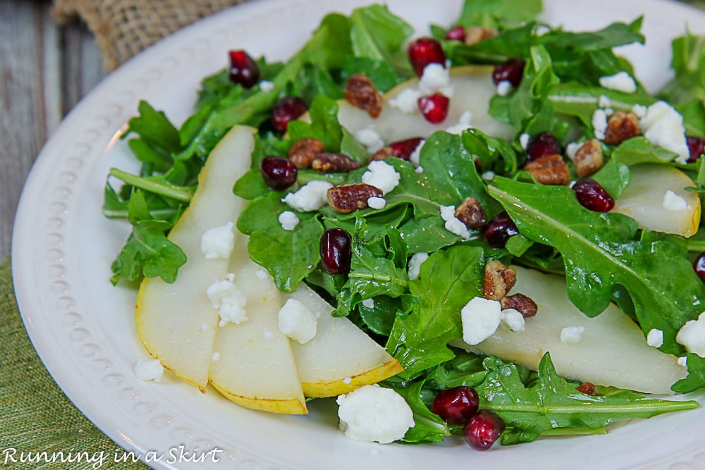 Arugula and Pear Salad close up of pears on white plate.