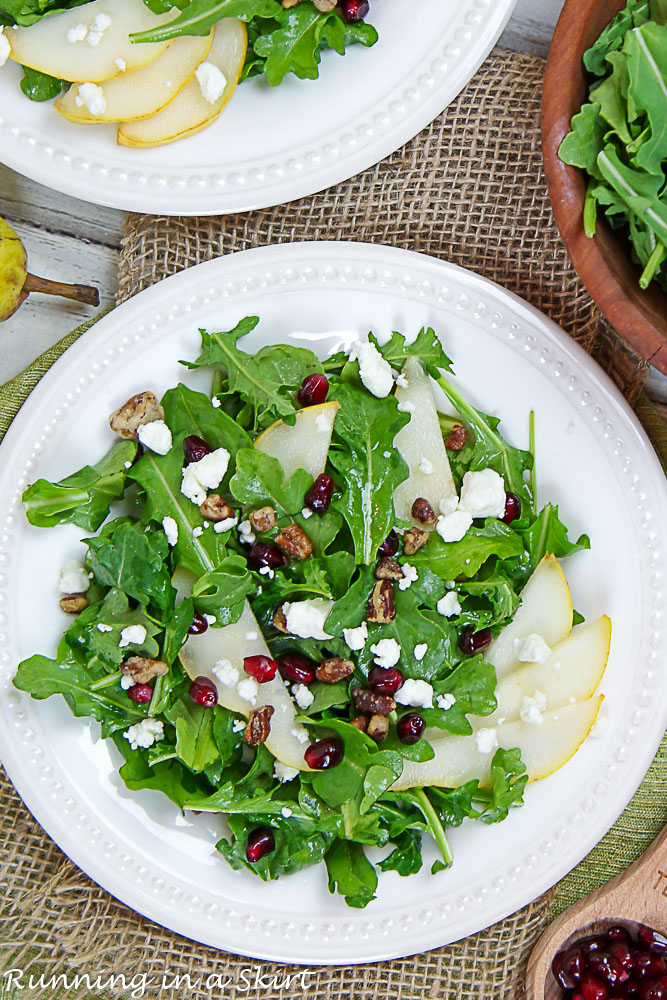 Arugula and Pear Salad on a white plate.