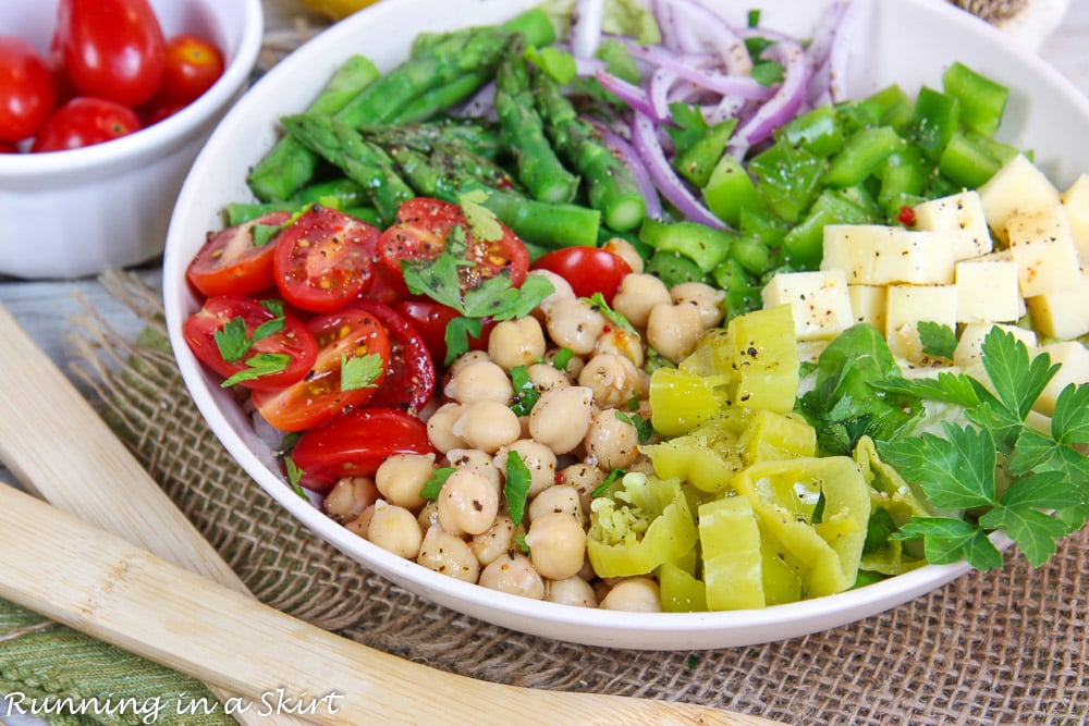 Italian Chopped Salad recipe with wooden serving spoons.