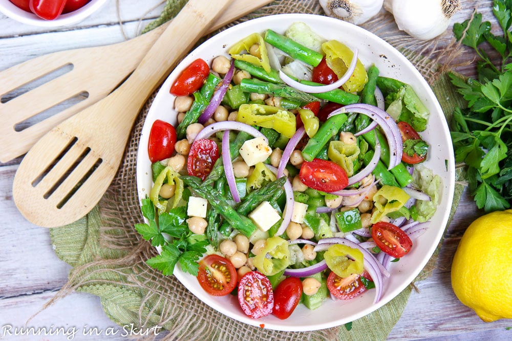 Process photo showing how to toss the chopped salad.