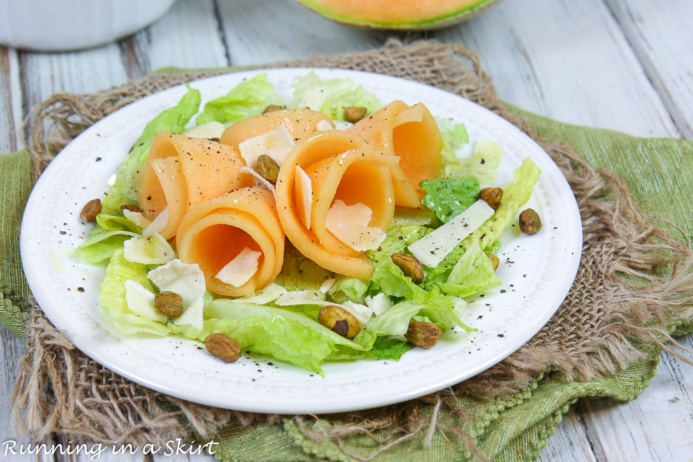 Tuscan Melon on a plate with the salad.