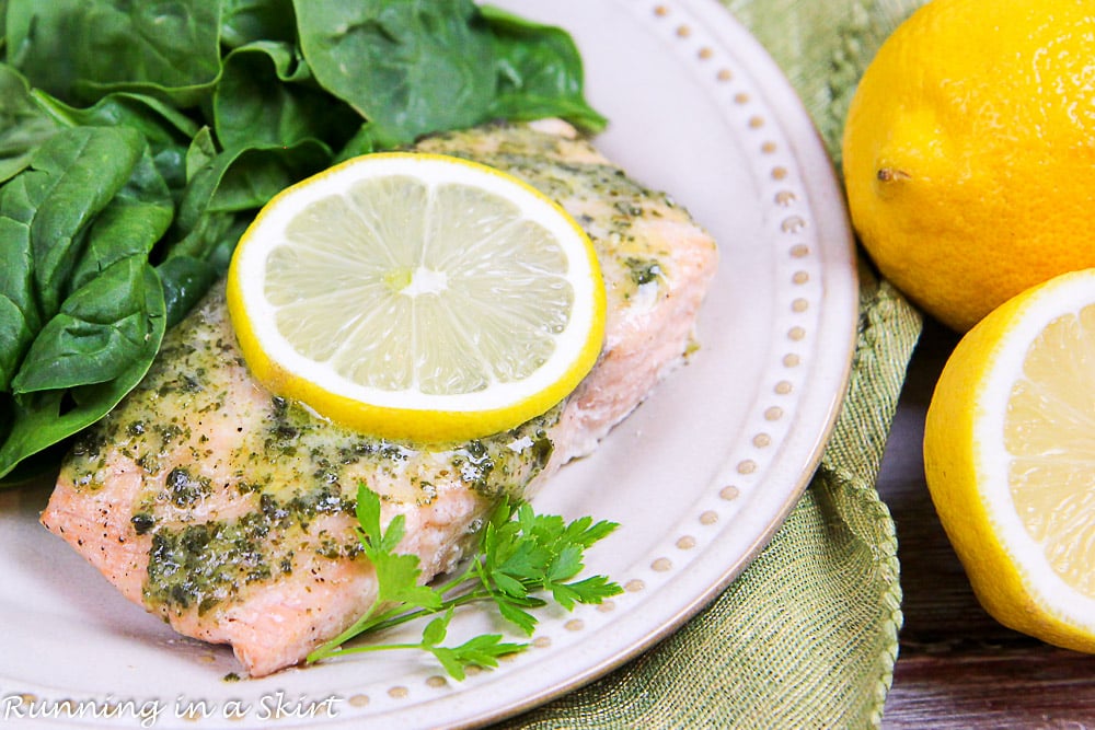 Lemon Pesto Salmon recipe on a white plate with spinach.