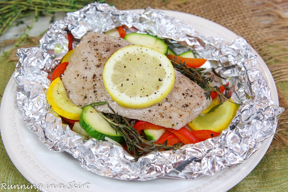 Baked Fish in Foil on a white plate.