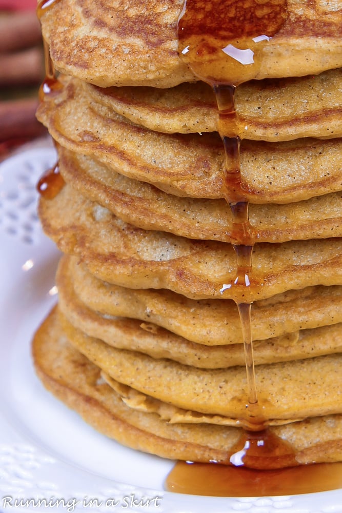 Close up of the syrup drizzling down the pumpkin pancakes.