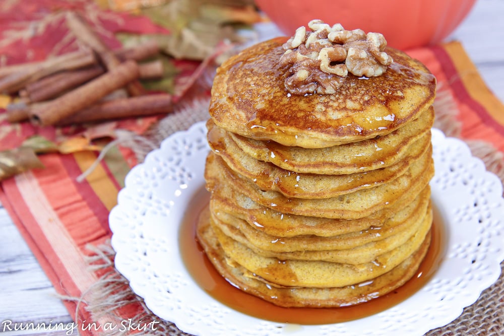 Stack of the pancakes with walnuts on top.