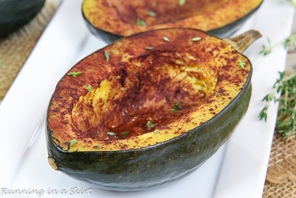 Healthy Baked Acorn Squash recipe on a white plate.