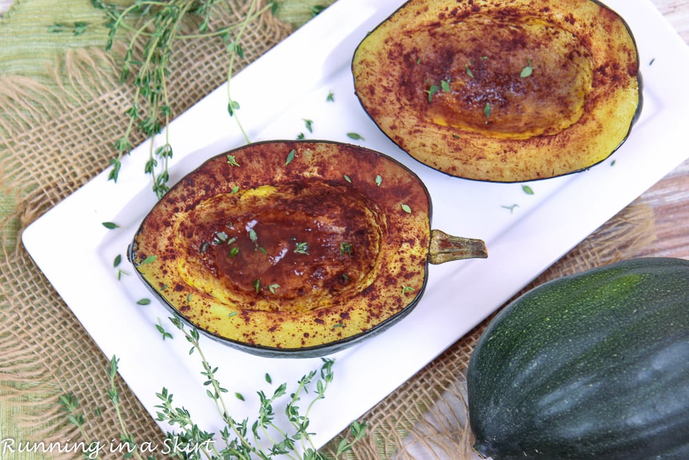 Healthy Baked Acorn Squash recipe on a white plate overhead shot.