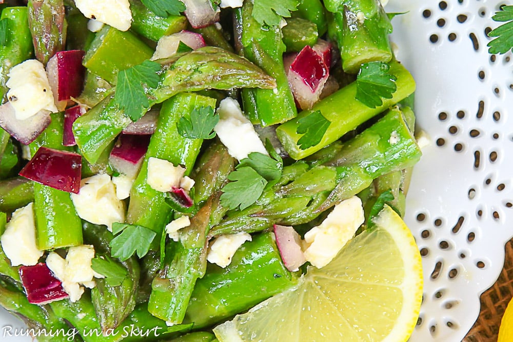 Overhead shot of the asparagus on a white plate.