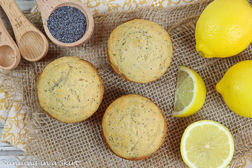 Overhead shot of the muffins, lemon and poppy seeds.