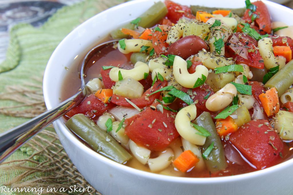 Easy Crockpot Minestrone Soup with a spoon in a bowl.