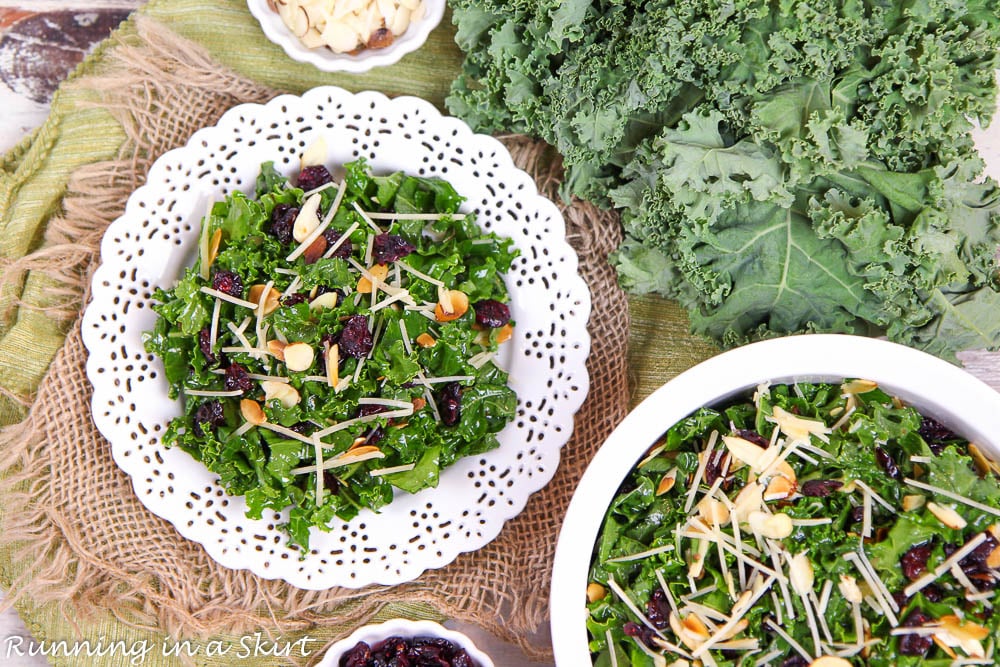 Chopped Kale Salad with Cranberries massaged on a plate and in a serving bowl.