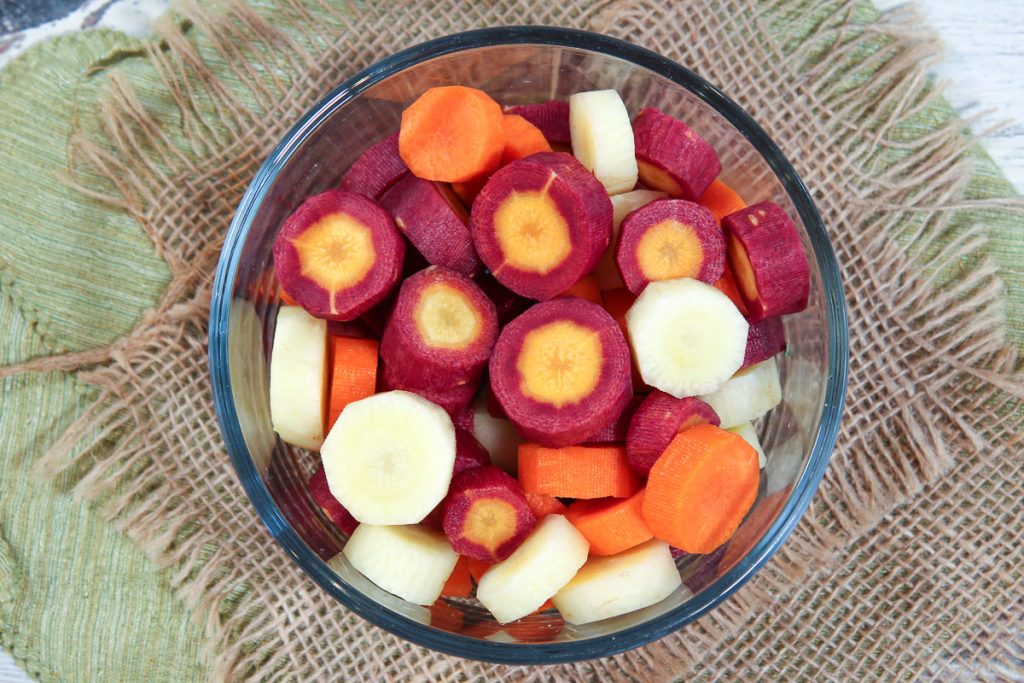 Close up of cut up rainbow carrots.