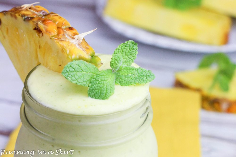 Pineapple Mint Smoothie with a mint and pineapple garnish.