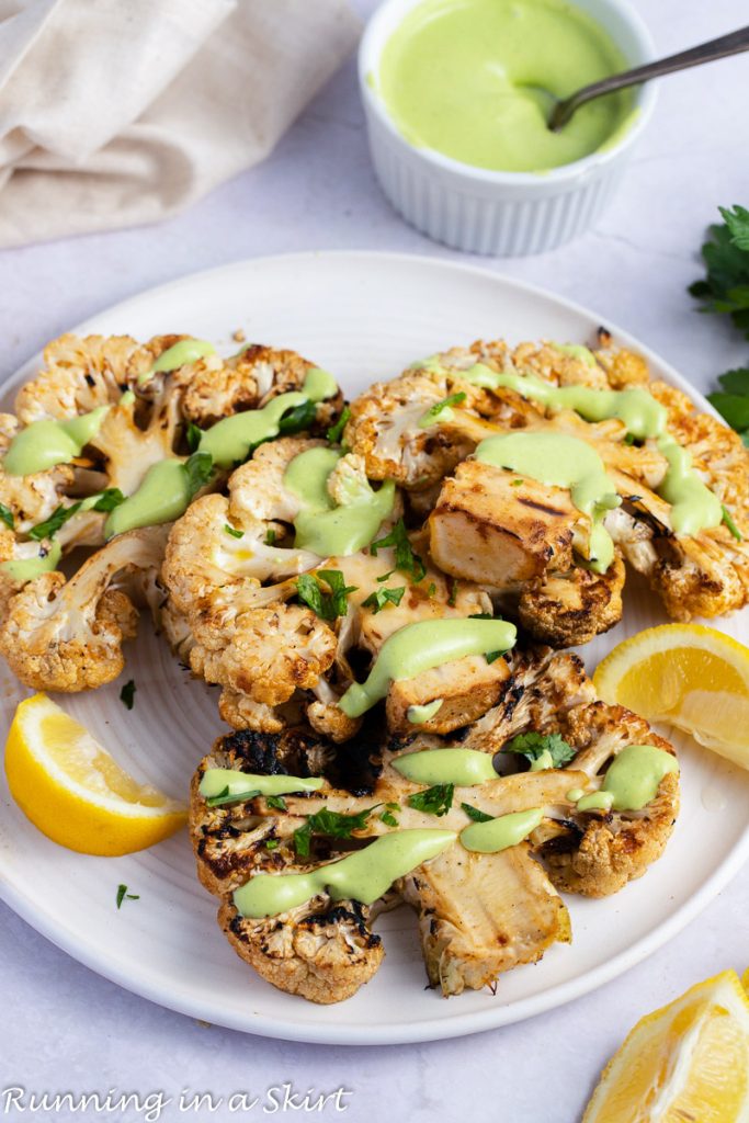 Grilled Cauliflower Steak on a white plate.