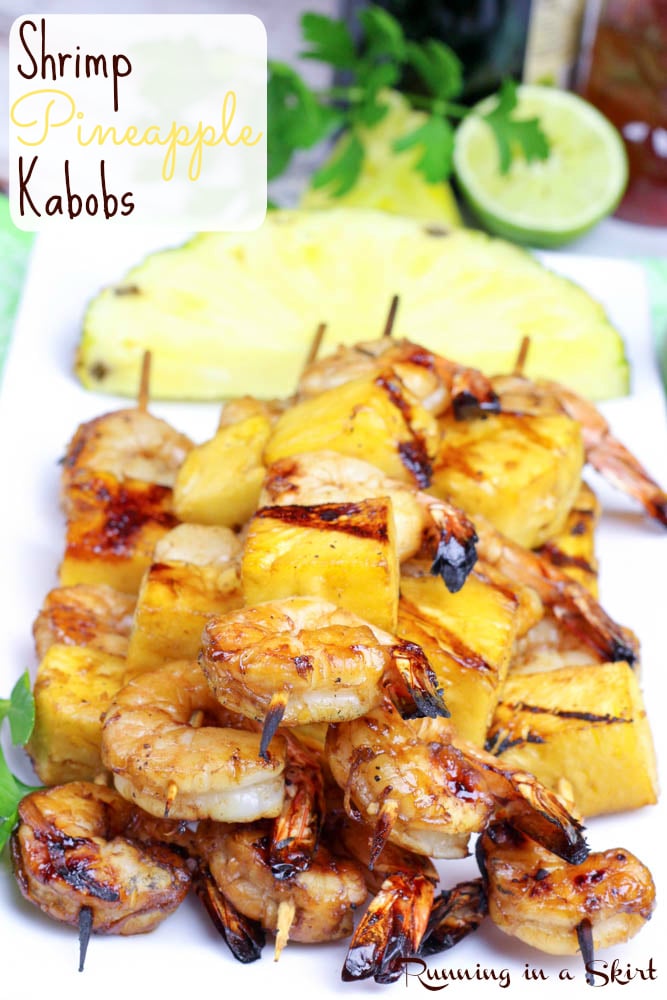 Shrimp Pineapple Kabobs on plate with pineapple in the background.