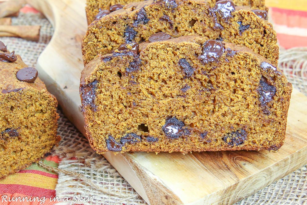 Finished product with a slice of the Healthy Greek Yogurt Pumpkin Bread.