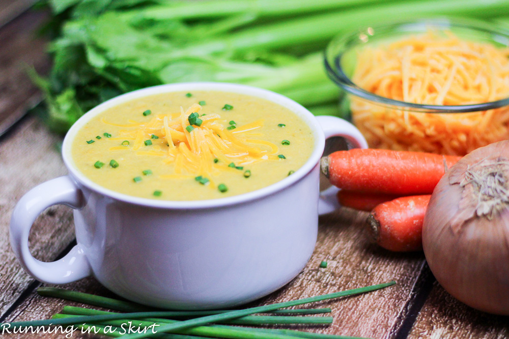 Cauliflower soup in a white serving bowl.