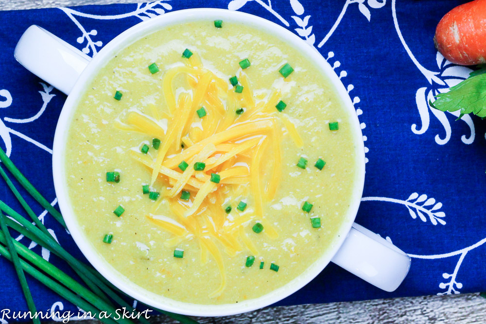 Cauliflower soup in a white serving bowl.