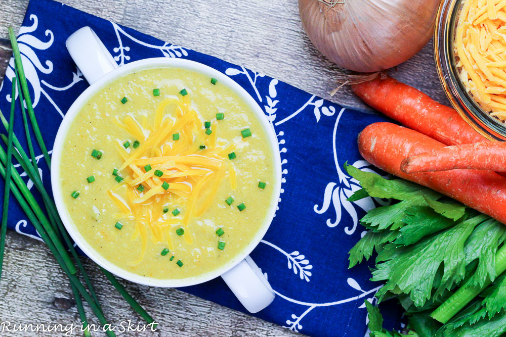 Cauliflower soup in a white serving bowl.