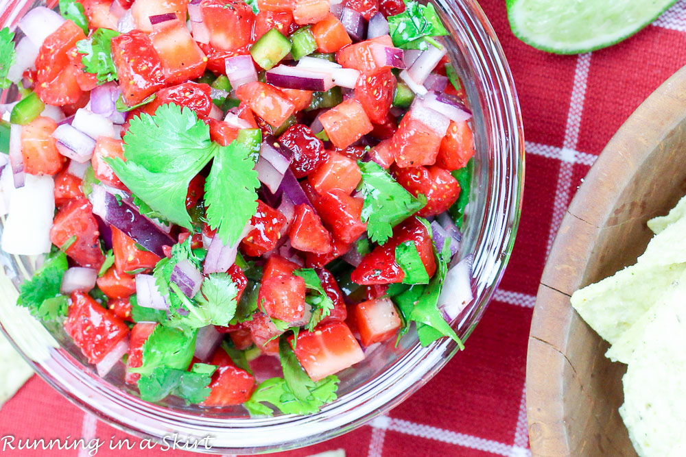 Close up of Strawberry Salsa in a bowl showing how to mix it.