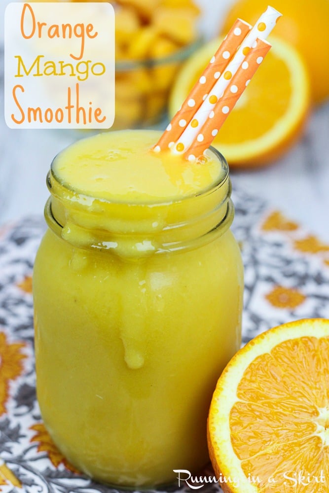 Orange Mango Smoothie in a glass jar with straws.