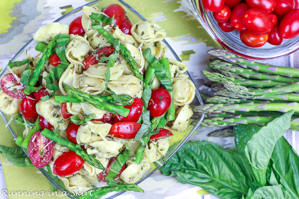 Overhead shot of asparagus, tomato and basil.