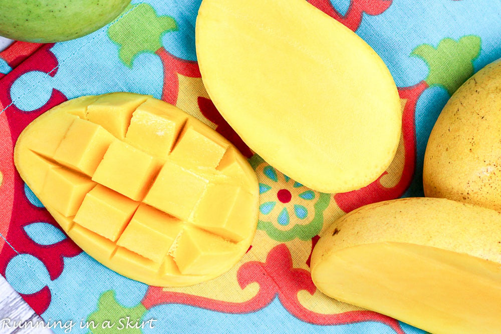 Cut mangoes on a table.