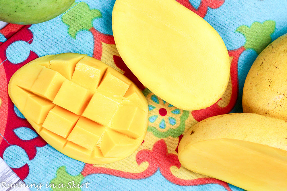 Cut mangoes on a table.