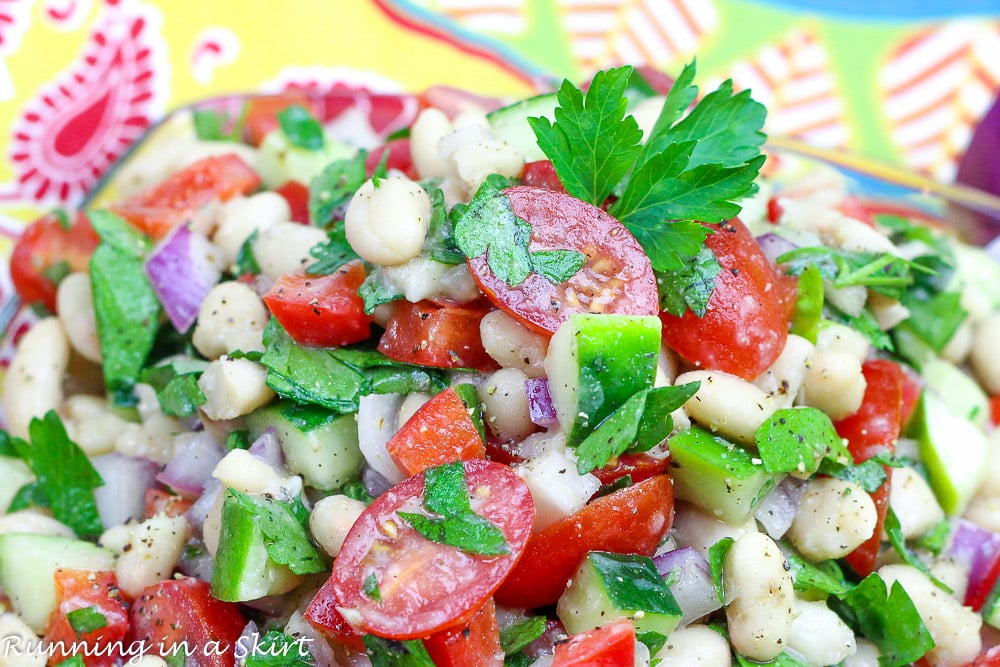 Close up of tomato and fresh herbs.