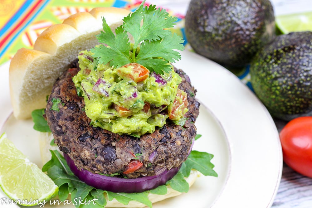 Homemade Southwest Black Bean Burgers with Gaucamole on a white plate.