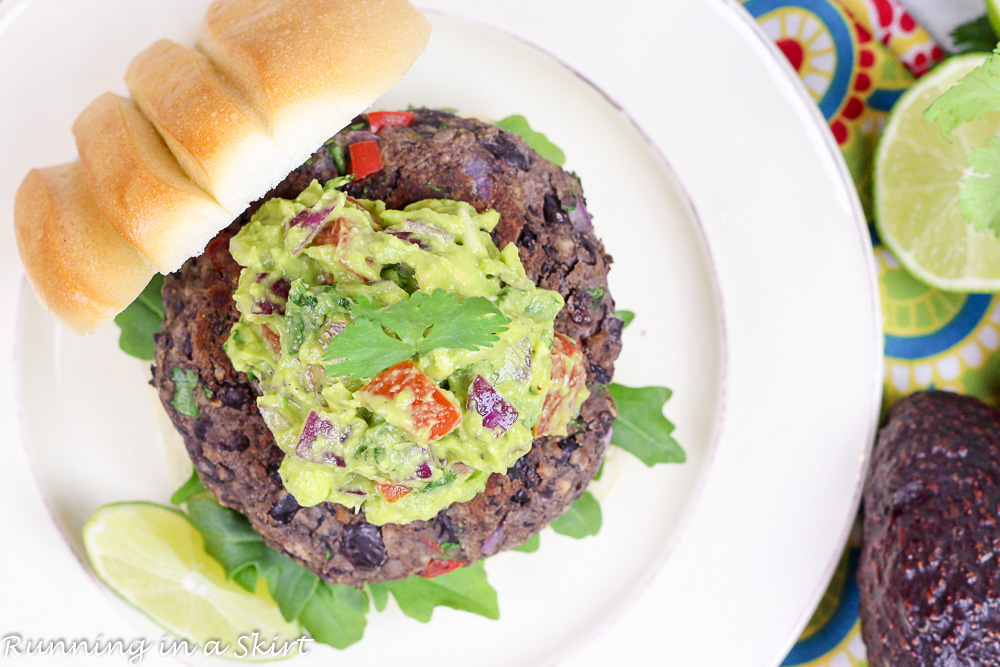 Homemade Southwest Black Bean Burgers with Gaucamole overhead shot with limes.