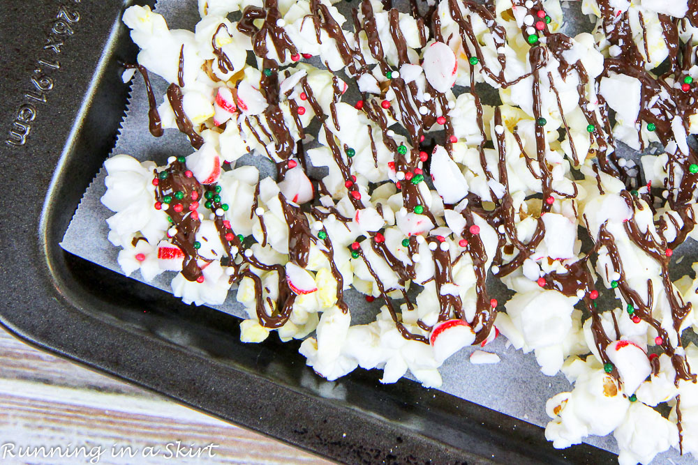 Peppermint Popcorn on a baking sheet.