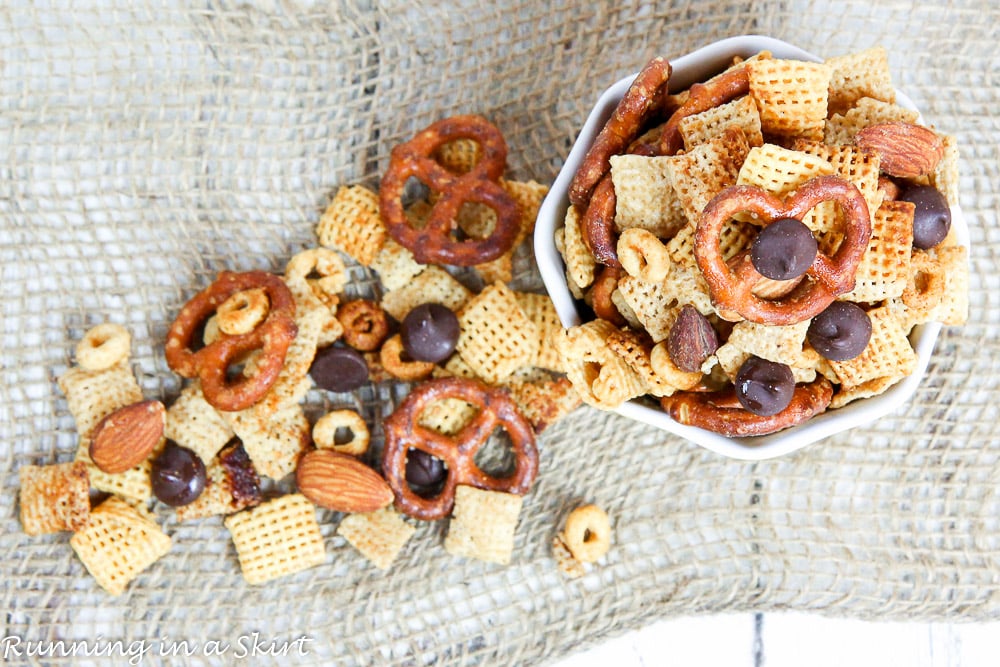 Healthy Crock Pot Chex Mix -- Sweet and SaltyChex Mix overhead shot with chex mix falling out of a bow.
