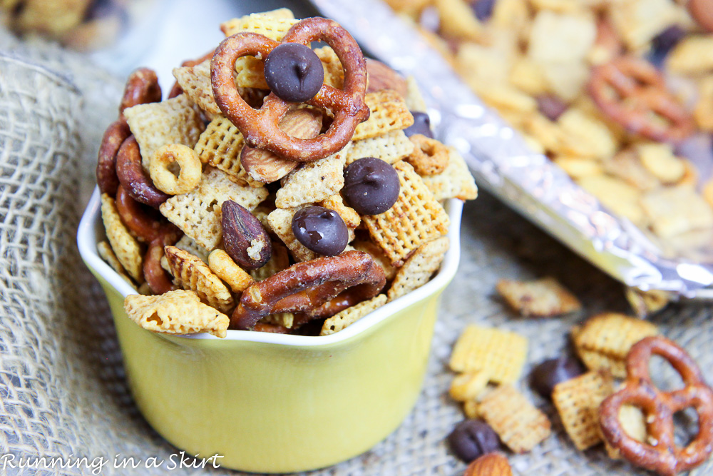 Healthy Crock Pot Chex Mix -- Sweet and Salty Chex Mix in a small yellow bowl with a baking sheet.