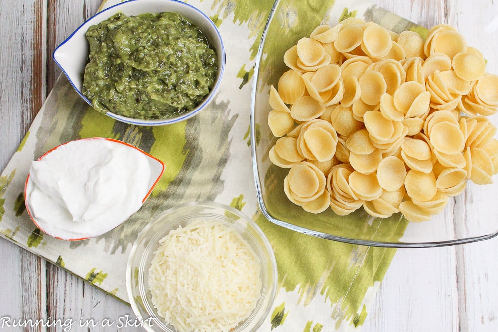 Ingredients laid out for healthy pesto pasta.