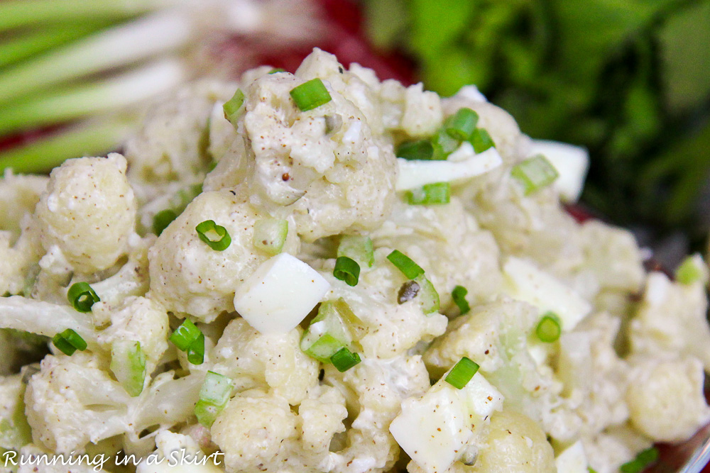 Close up of cauliflower, eggs and green onions.