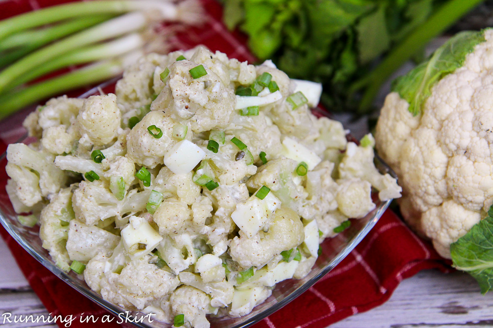 Low Carb Potato Salad in a glass bowl on a red napkin.