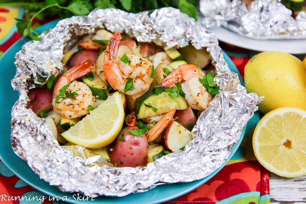 Fast Healthy Grilled Shrimp in Foil Recipe finished product on a teal plate.