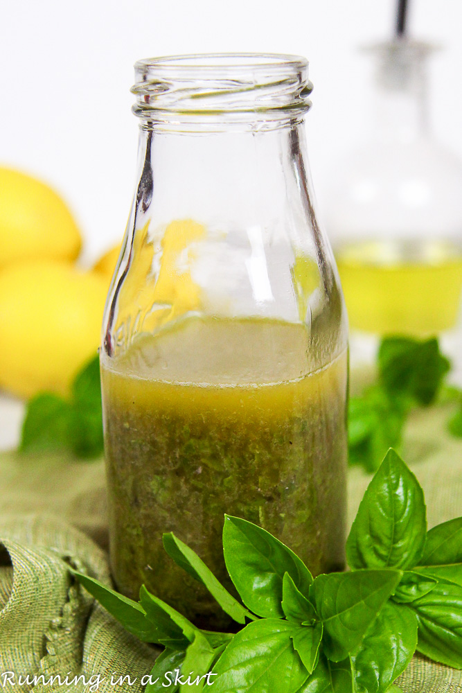 Lemon Basil Vinaigrette Salad Dressing close up in a glass jar.