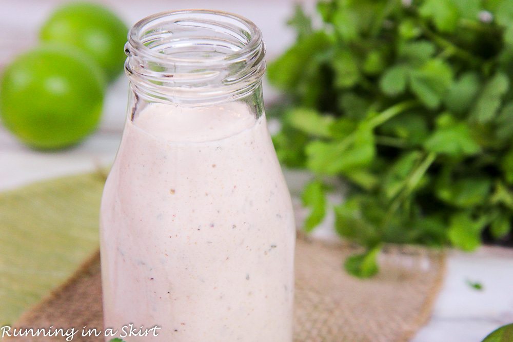 Close up of glass bottle with healthy greek yogurt chipotle dressing.