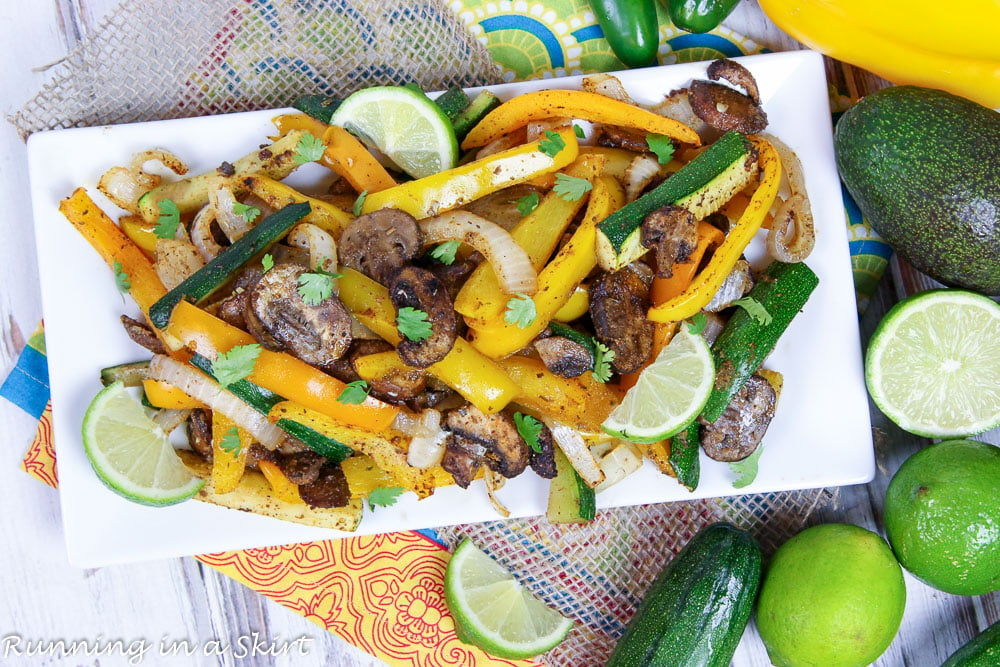 Overhead shot of Vegetarian Fajitas on a white plate.