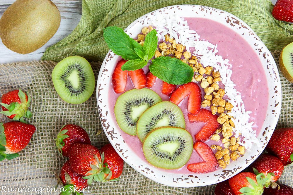 Overhead shot of Kiwi Strawberry Smoothie Bowl Recipe in a white bowl.