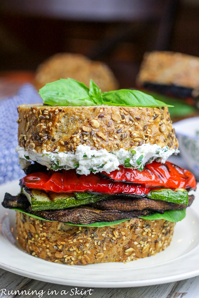 Grilled Vegetable Sandwich with Herbed Goat Cheese with basil on top.