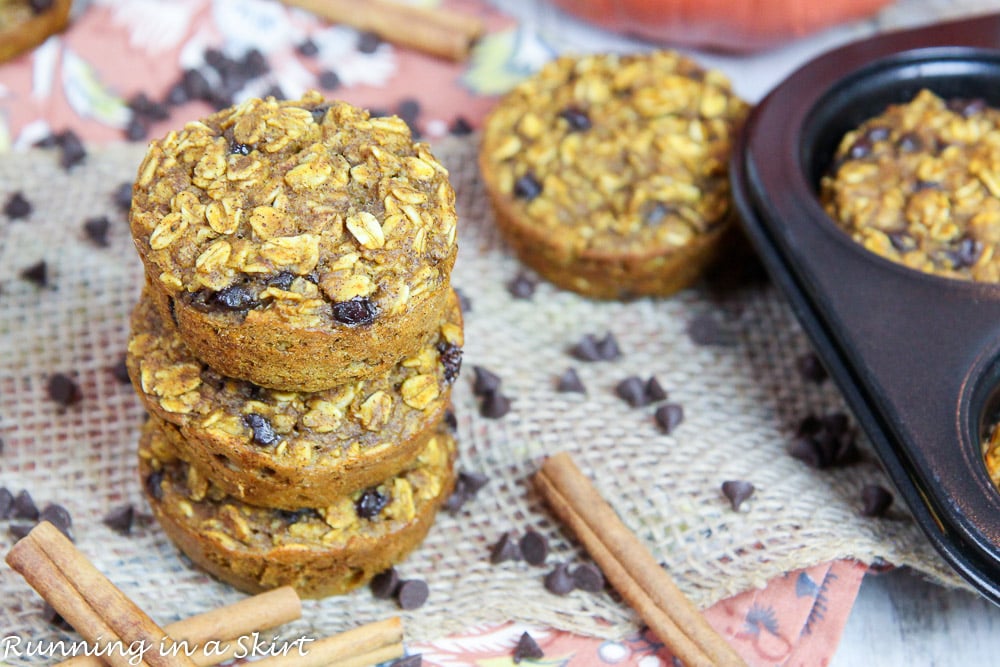 Pumpkin Baked Oatmeal Cups on a napkin with cinnamon sticks.