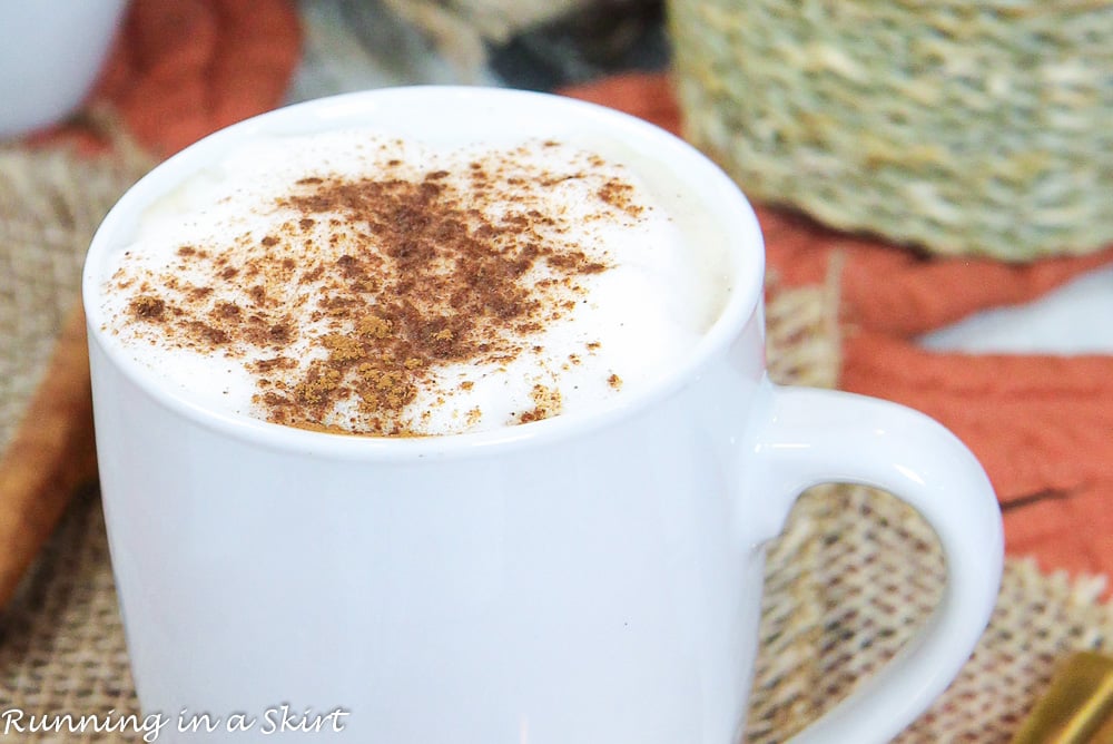 White mug with dirty chai latte.