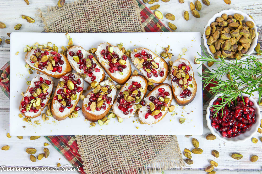 Pistachio Pomegranate Crostini Appetizer for Christmas on a plate.