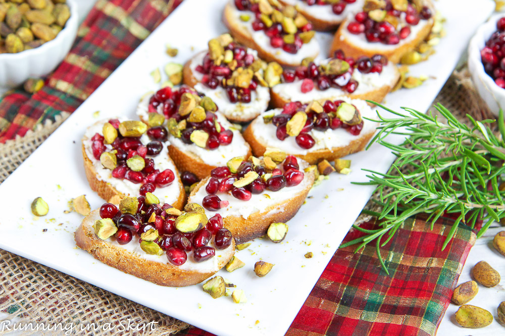 Pistachio Pomegranate Crostini Appetizer for Christmas on a plate.