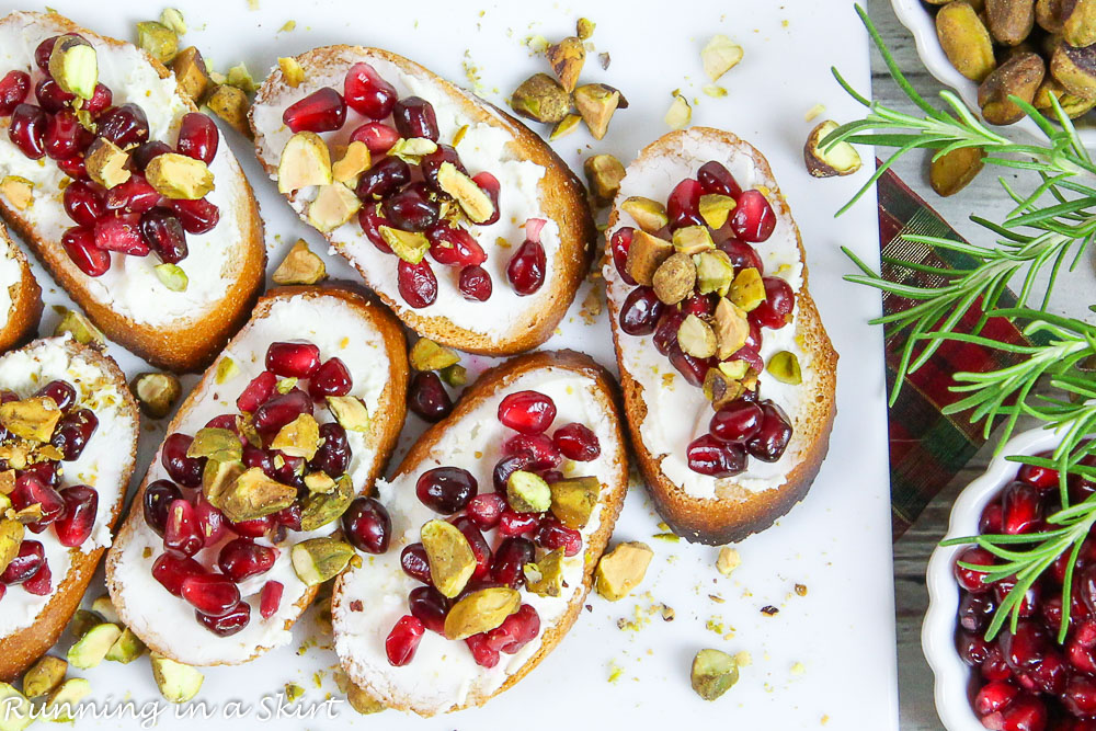 Pistachio Pomegranate Crostini Appetizer for Christmas on a plate.