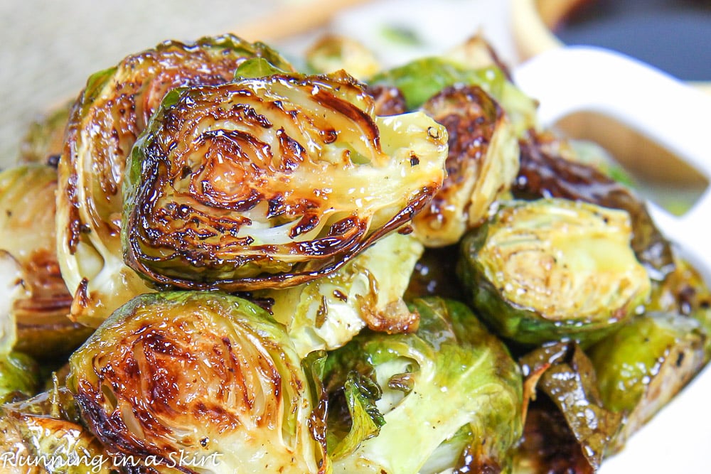 Close up of the Roasted Teriyaki Brussels Sprouts recipe in a white dish.