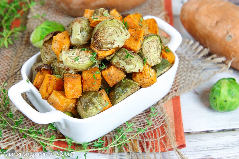 Roasted Brussels Sprouts and Sweet Potatoes in a white dish.